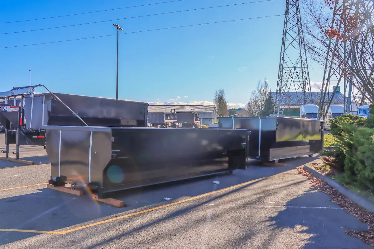 Roll-off dumpster ready for waste disposal at job site for 12 Yard Dumpster Rental in Troy